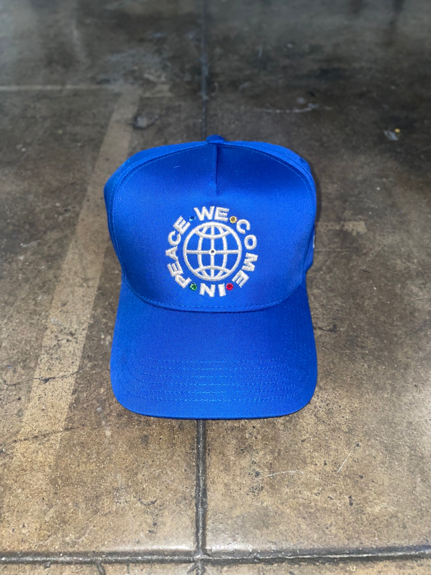 “WeComeInPeace” SNAPBACK HAT