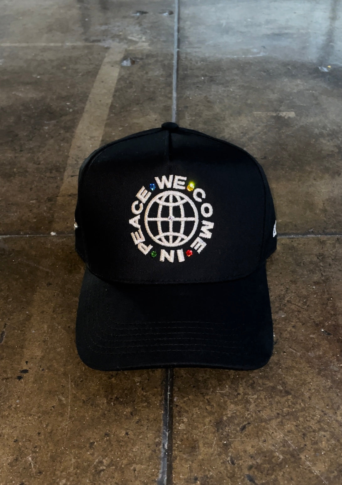 BLACK “WeComeInPeace” SNAPBACK HAT